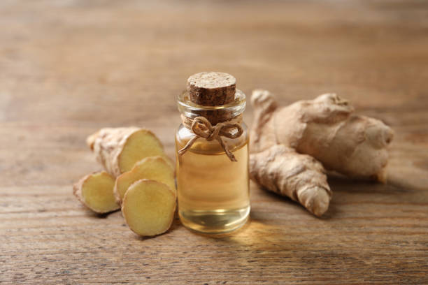 istock Ginger essential oil in bottle on wooden table 1412620570