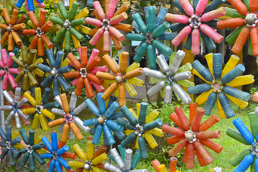 Flower shaped colourful decorations made of plastic bottles