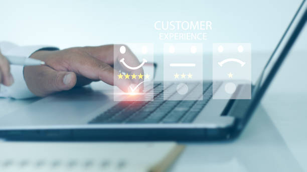 istock Customer Service Assessment Concept. A businessperson evaluates satisfaction, presses a smiley face to show emoticons on a virtual screen, a survey, or customer satisfaction research 1412624586