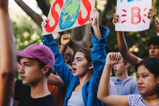 istock Teenagers campaigning to save planet earth 1412625855