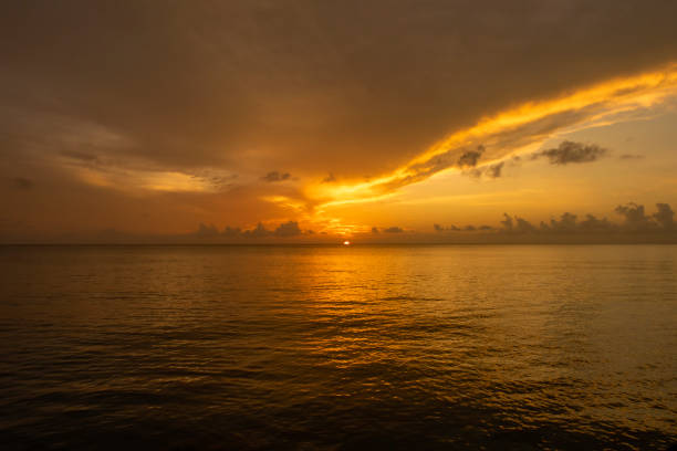 A magnificent orange sunset in Cozumel, Mexico stock photo
