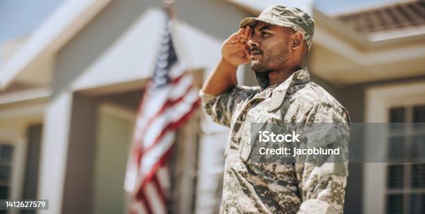 Patriotic Young Soldier Saluting Outdoors Stock Photo - Download Image Now - US Veteran's Day, US Military, Saluting