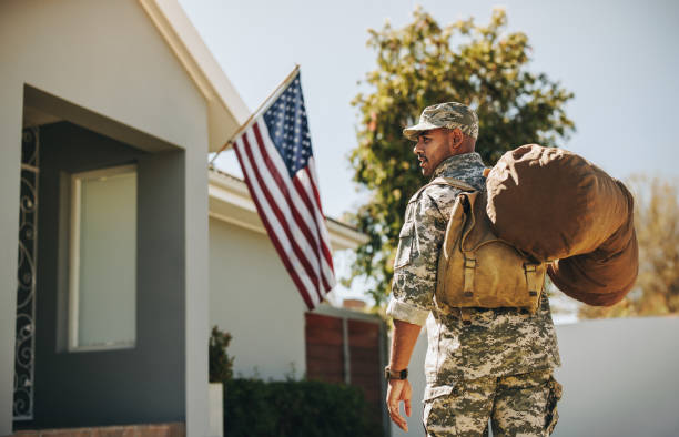 istock Courageous soldier returning home from the army 1412627733