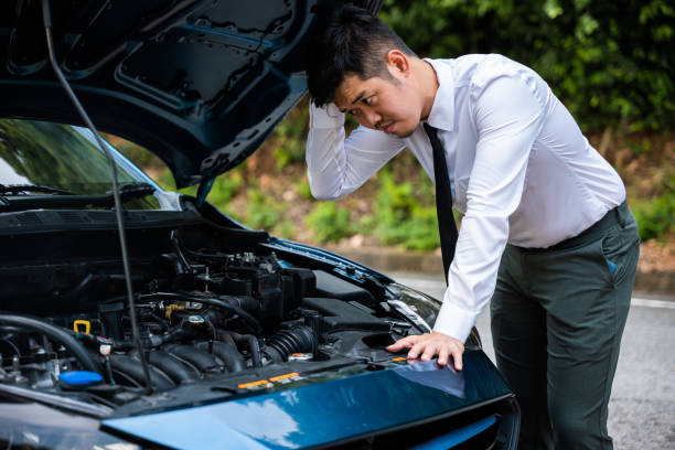 istock Asian businessman car broken breakdown 1412628366