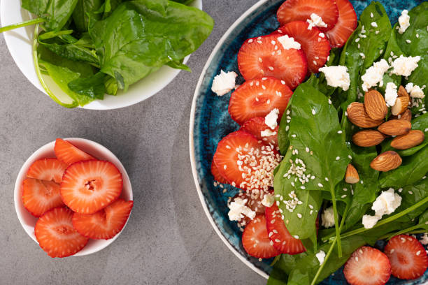istock Fresh salad with strawberry fruit, almond, spinach and cottage cheese 1412629855