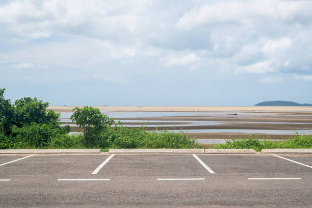 istock Empty parking lot against sea and beautiful blue sky. 1412631524