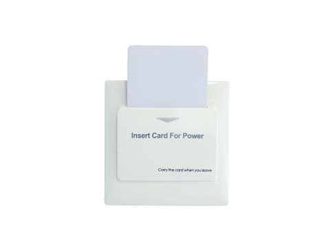 Insert card for power on wall in hotel is isolated on white background with clipping path.