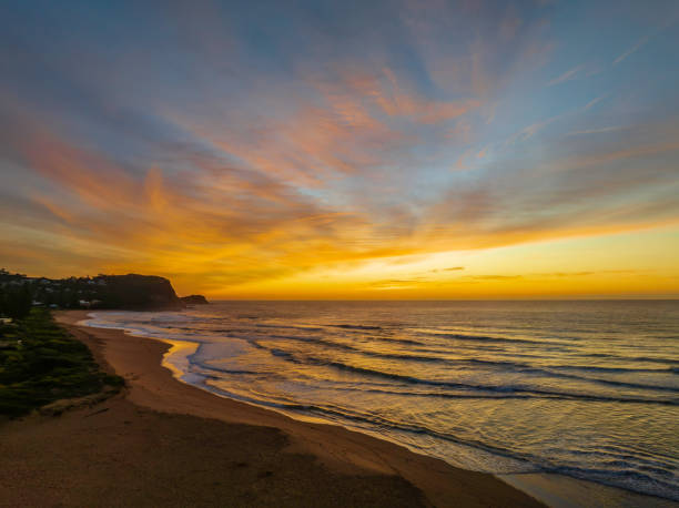 istock Sunrise and high cloud cover over the sea 1412631900