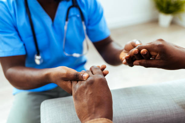 istock Medical practitioner holding a patient's hand in comfort 1412632085