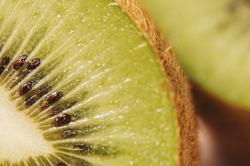 Kiwi close up macro of fruit \nPhoto taken with strobe indoors