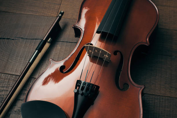 istock A old violin on a wooden table 1412634025