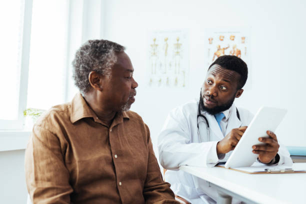 istock Doctor showing a senior patient some information on a digital tablet. 1412634339