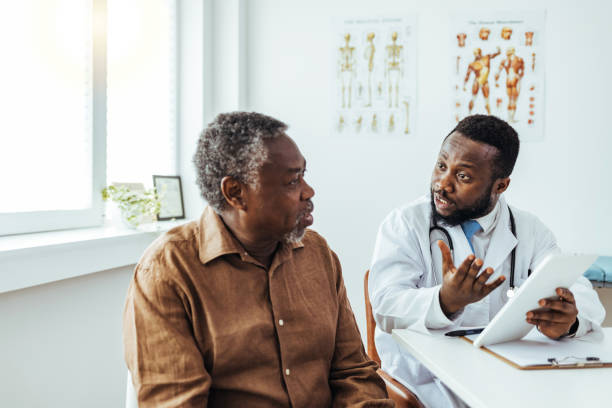 istock Doctor listens seriously to patient concerns about drug side effects 1412634352