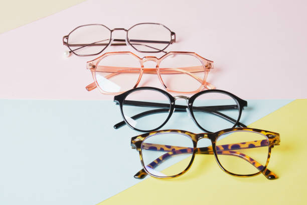 istock multiple eyeglasses on a multicolored background of pastel colors, geometric background, pink yellow and light blue colors, trendy eyeglass frames 1412635246