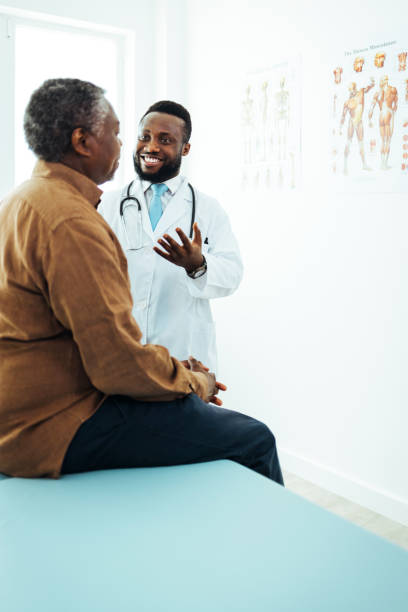 istock Mental health professional gestures while talking with senior patient. 1412635505