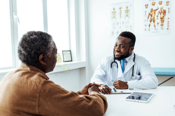 istock Confident doctor listens to patient 1412635548