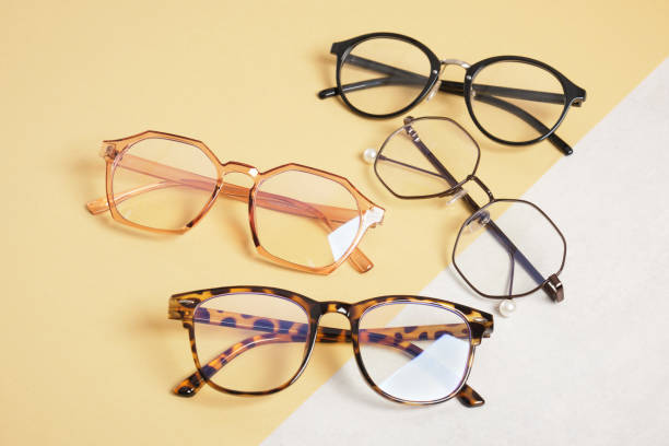 istock several trendy stylish eyes glasses on beige and gray background copy space 1412638174
