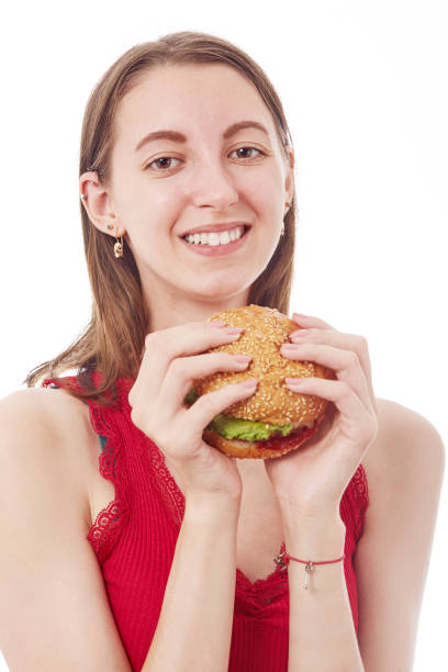 istock girl with cheeseburger 1412639863