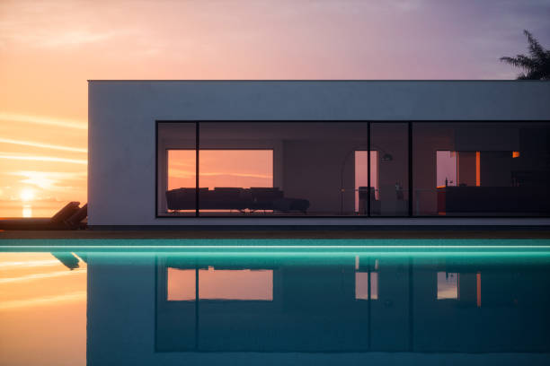 sunset view luxury tropical pool villa - mansion fotografías e imágenes de stock