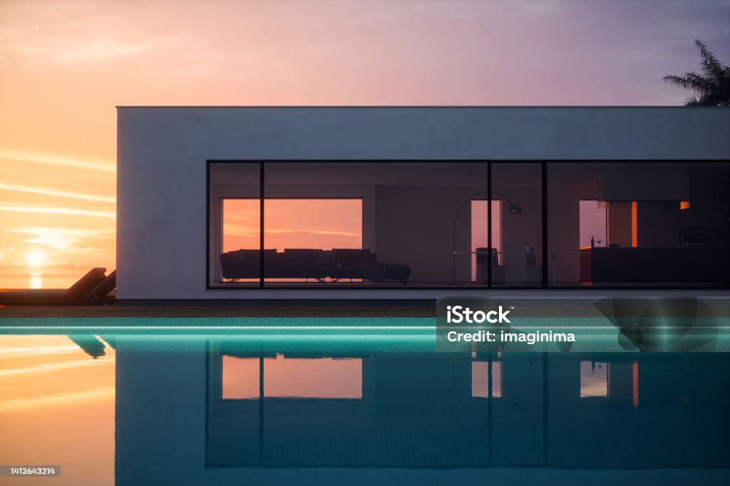 Sunset View Luxury Tropical Pool Villa Luxury modern minimalist house with swimming pool and beautiful sea view. Luxury Stock Photo