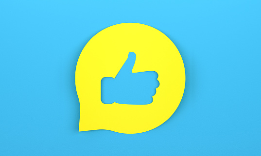 Yellow speech bubble with Like icon on blue background. Communication Concept.