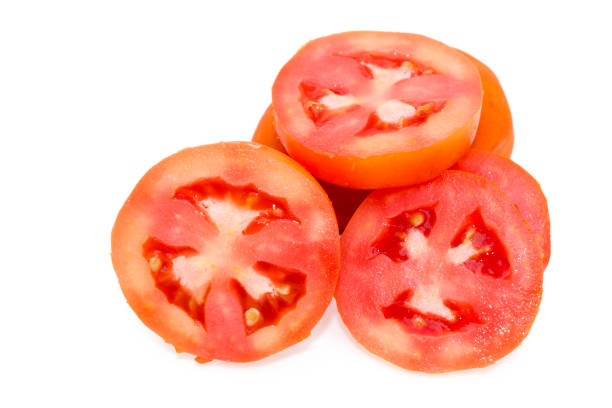 istock Fresh organic cherry tomatoes slices isolated on white background, Close up 1412644546