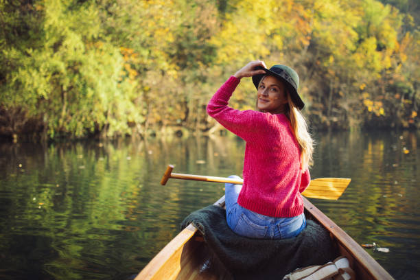 istock Woman enjoying perfect day on canoe 1412646353