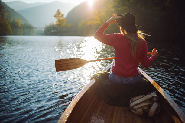 istock Woman enjoying perfect day on canoe 1412646405