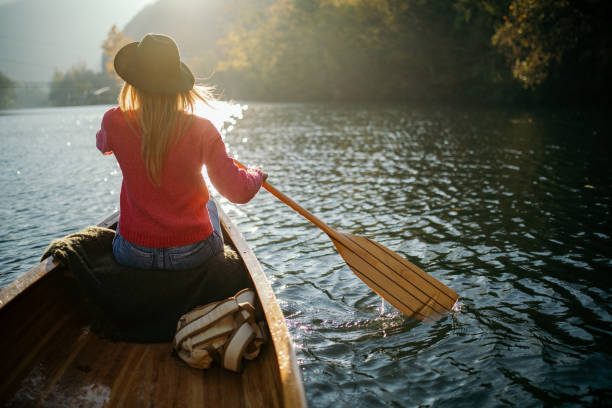 istock Woman enjoying perfect day on canoe 1412646468