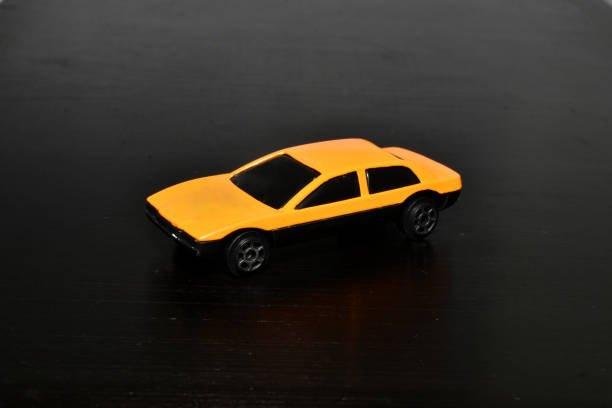 istock Racing passenger car yellow on black. 1412649579
