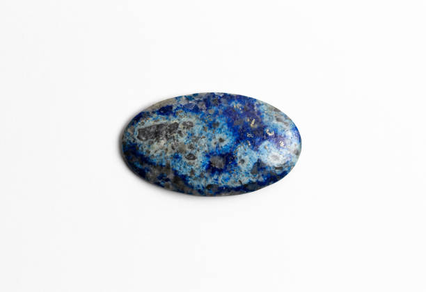 istock Lazurite Mineral Cabochon on white Background. Tectosilicate. Lapis lazuli specimen 1412651055