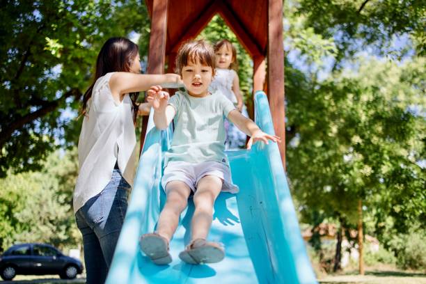 istock Little girl having fun while sliding 1412653334