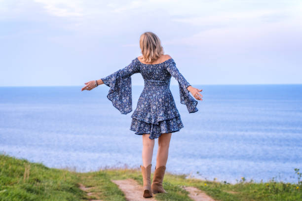istock Woman embracing nature 1412659958