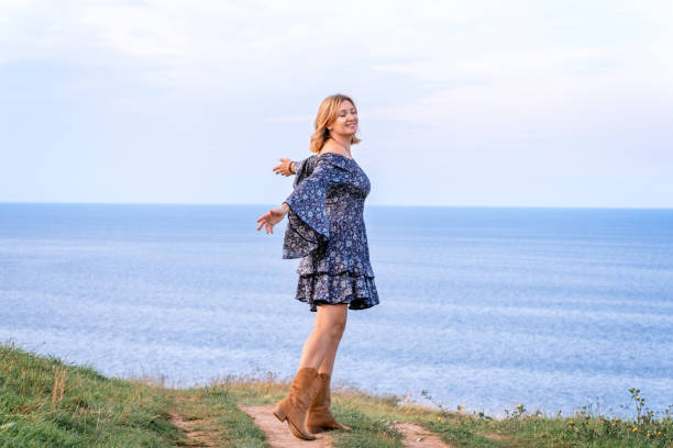 istock Woman embracing nature 1412659969