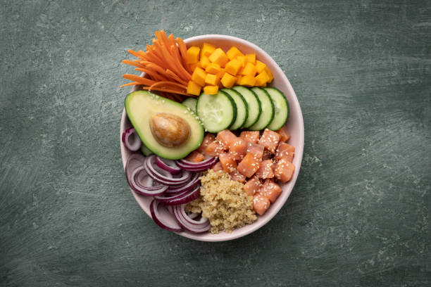 istock Poke bowl with quinoa and salmon and raw vegetables 1412660247