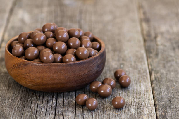 istock Chocolate covered chickpea, turkish traditional nuts, round small confectionery 1412662031
