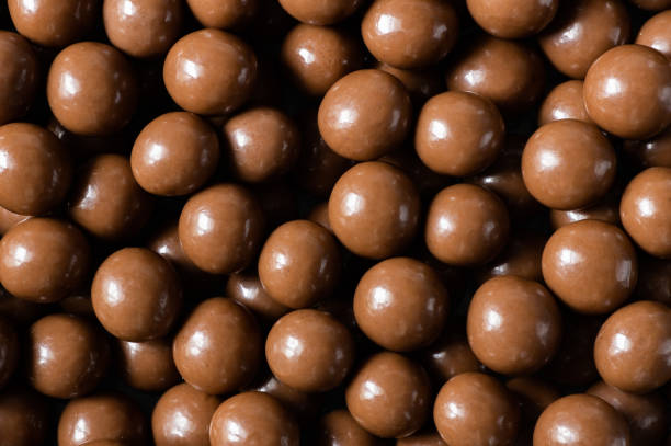 istock Chocolate covered chickpea, turkish traditional nuts, round small confectionery 1412662032