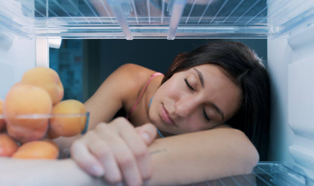 istock Woman cooling herself in the fridge 1412664535