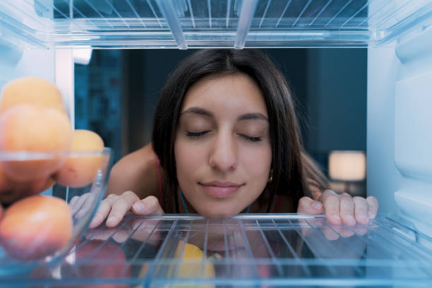 istock Woman cooling herself in the fridge 1412665680