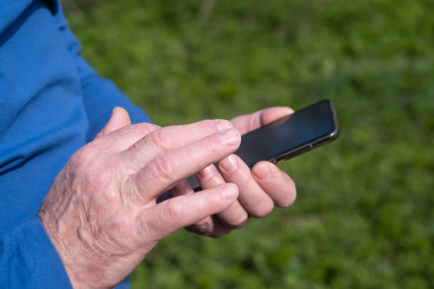 istock Close up of a man using mobile smart phone 1412665810