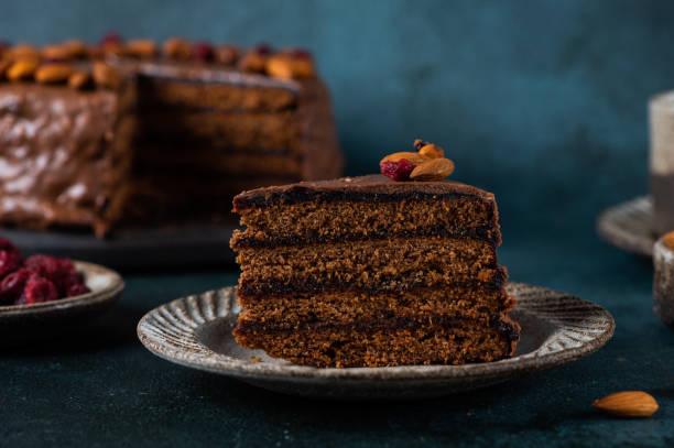 istock Chocolate Austrian dessert Sacher with apricot jam and nuts. Traditional austrian dessert. Sacher cake. Chocolate cake with jam 1412666745