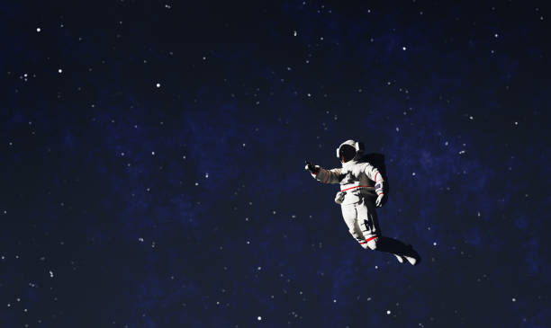 istock Astronaut spacewalk in space and pointing his finger. 1412669317