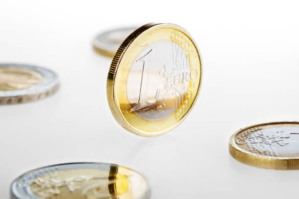 istock Shiny Euro coin - close-up, white background 1412669421