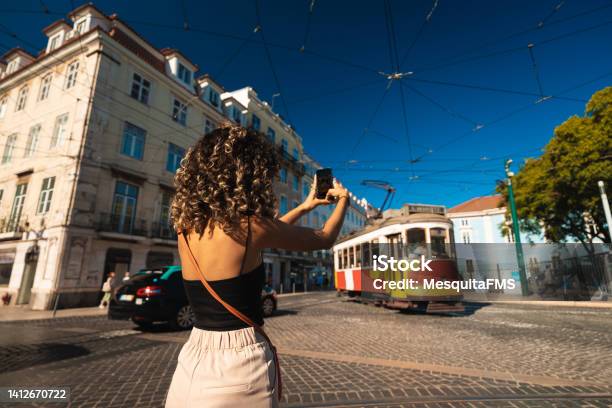 Tourist Taking Photo Of Tram In Lisbon Stock Photo - Download Image Now - Lisbon - Portugal, Travel, Tourist