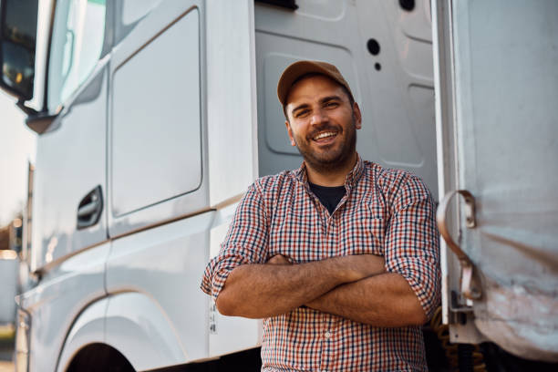 istock Professional truck driver with arms crossed looking at camera. 1412672555