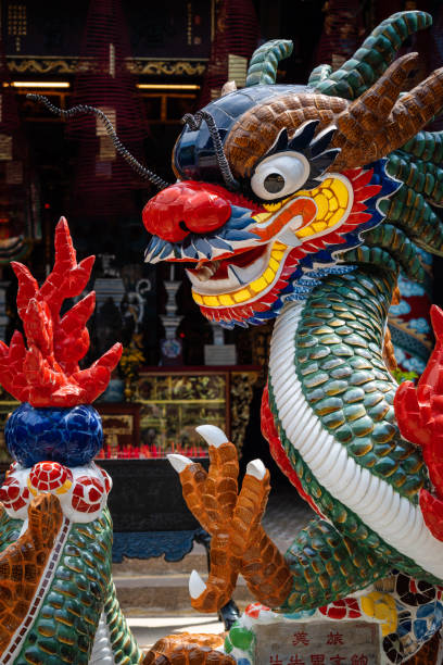 istock Beautiful dragon statue in Vietnamese temple. 1412674672