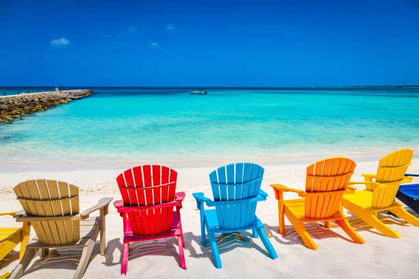 istock Idyllic beach with rustic adirondack chairs in Aruba, Dutch Antilles 1412675076
