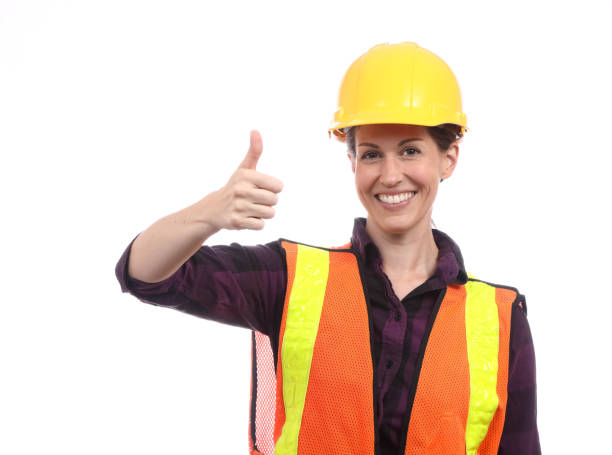 istock Construction Woman with Yellow Hardhat Thumbs Up Horizontal 1412675376