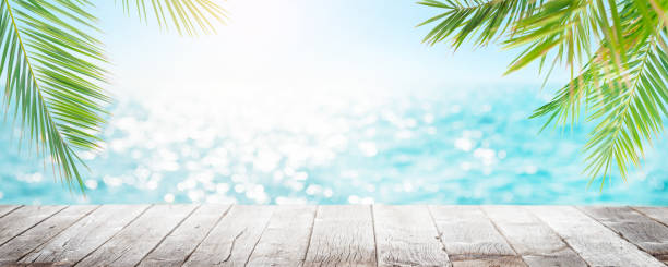 istock Empty wooden table or pier with sunny sea 1412675406