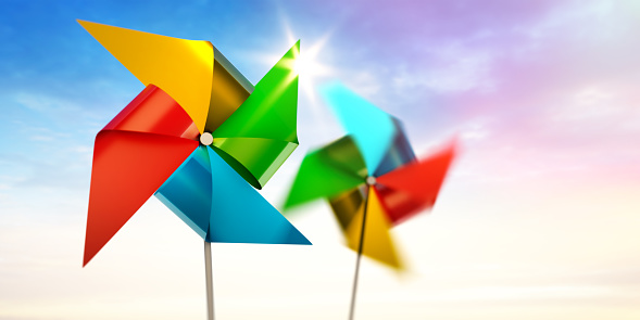 Colorful pinwheel toy with evening sunny sky background - 3D illustration